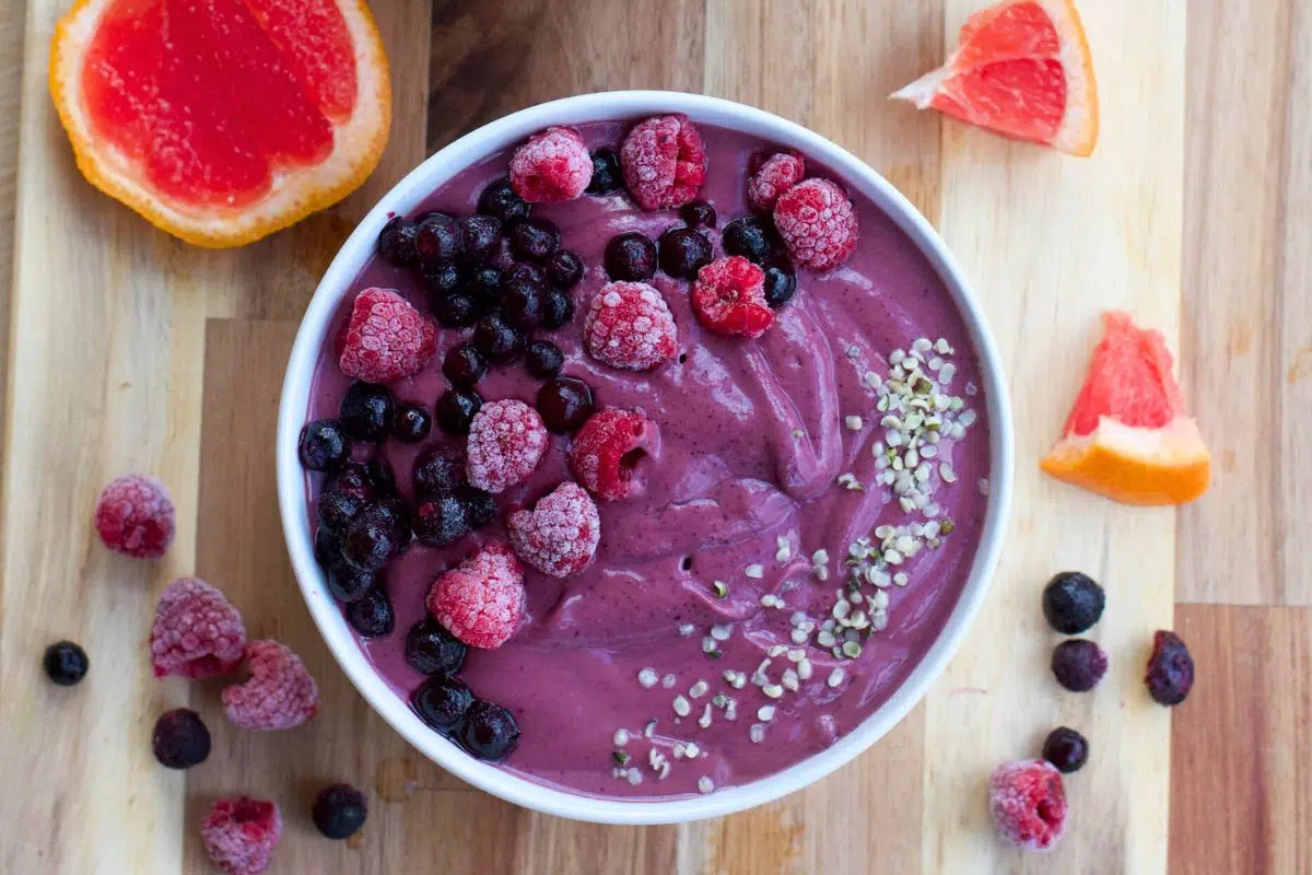 Purple Smoothie Bowl topped with berries.