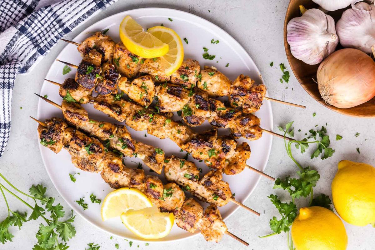 Garlic Parmesan Chicken Skewers with lemon slices.