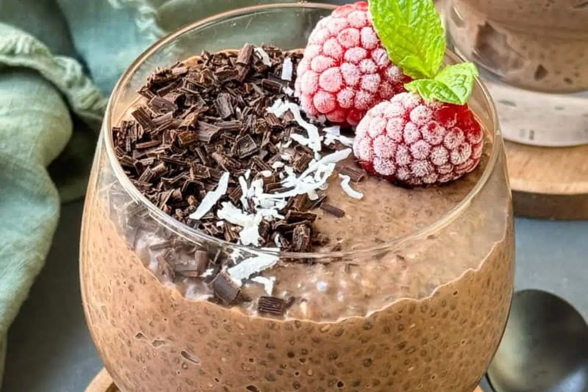 Chocolate chia pudding with berries on top.