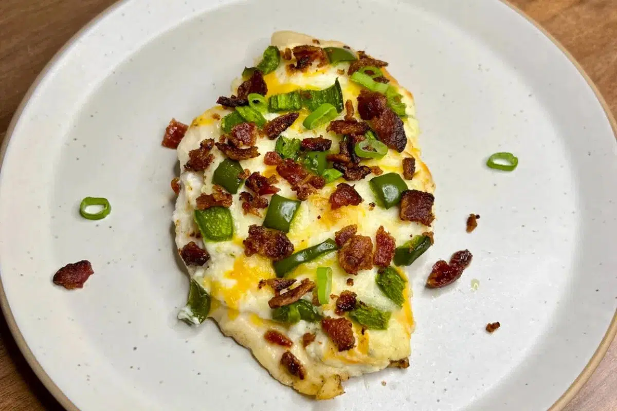 Jalapeño Popper Chicken topped with chopped spring onions.