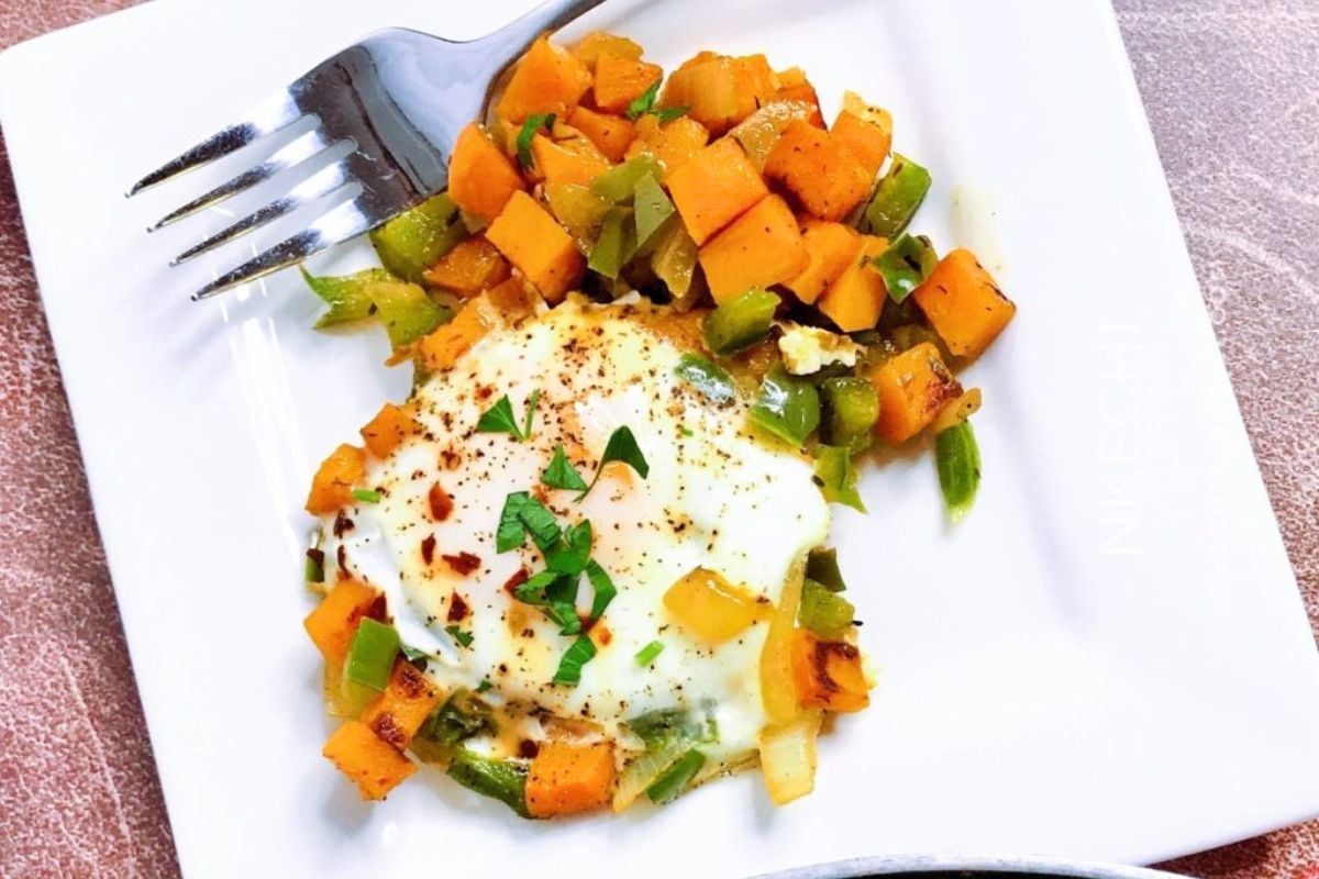 Sweet Potato Hash With Eggs served on a plate.