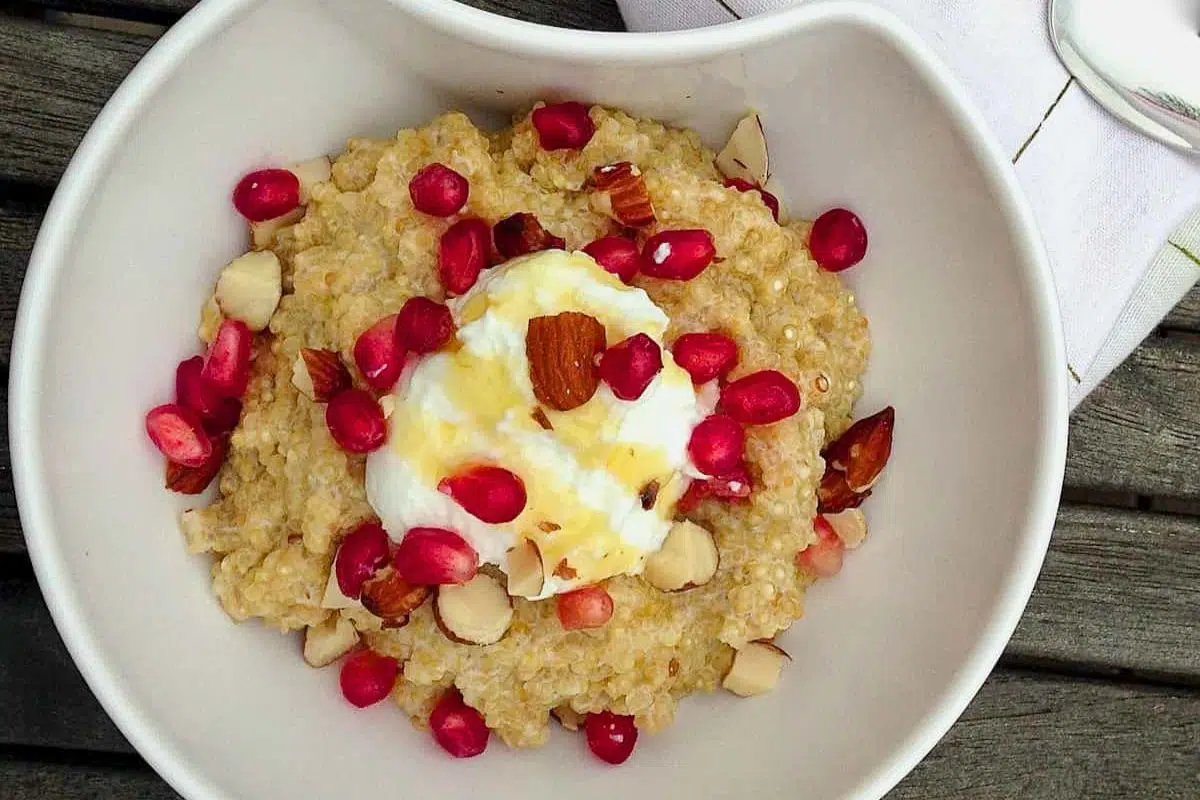 Toasted Quinoa Pomegranate Pudding served in a bowl.