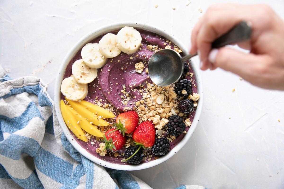 Acai Bowl topped with fruits.