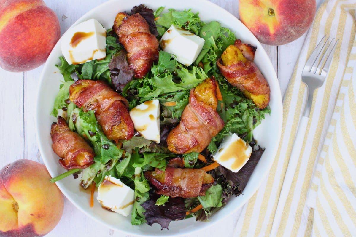 A plate of bacon wrapped peaches.