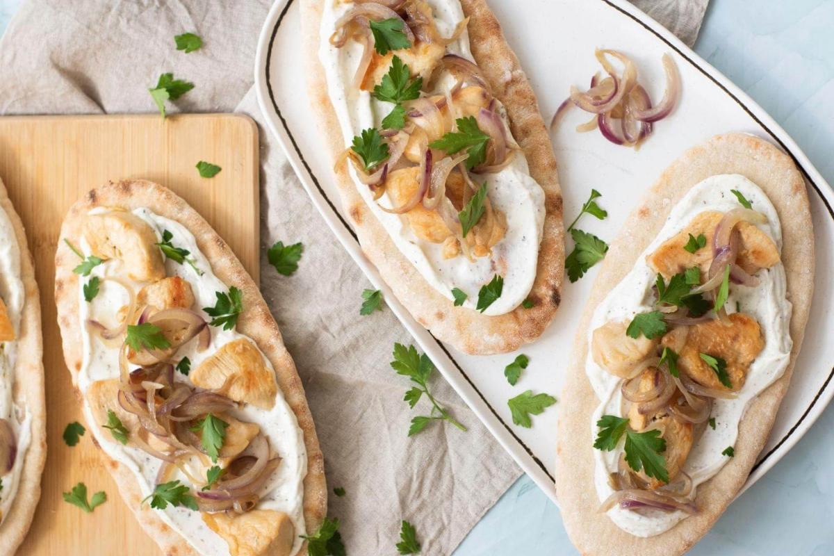 Gluten-free chicken pita stuffed with fresh toppings.