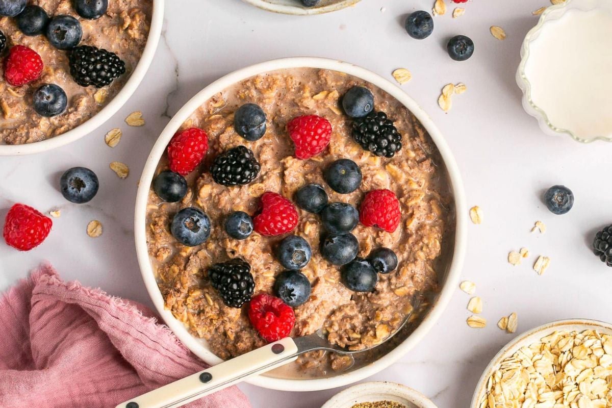 Chocolate Protein Oatmeal topped with berries.