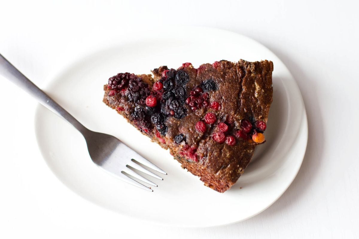 A slice of Chocolate Cake with Berries served on a plate.