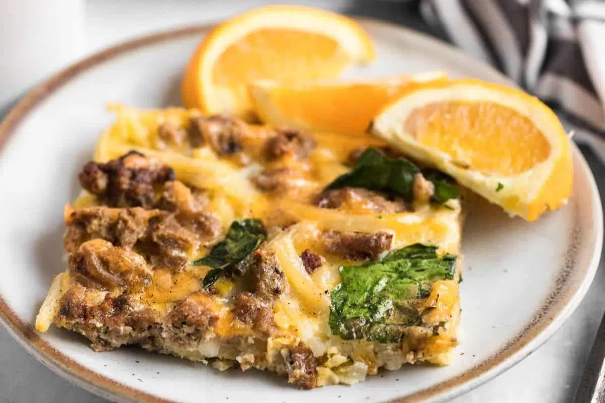 Sheet Pan Sausage Breakfast Pizza served on a plate.