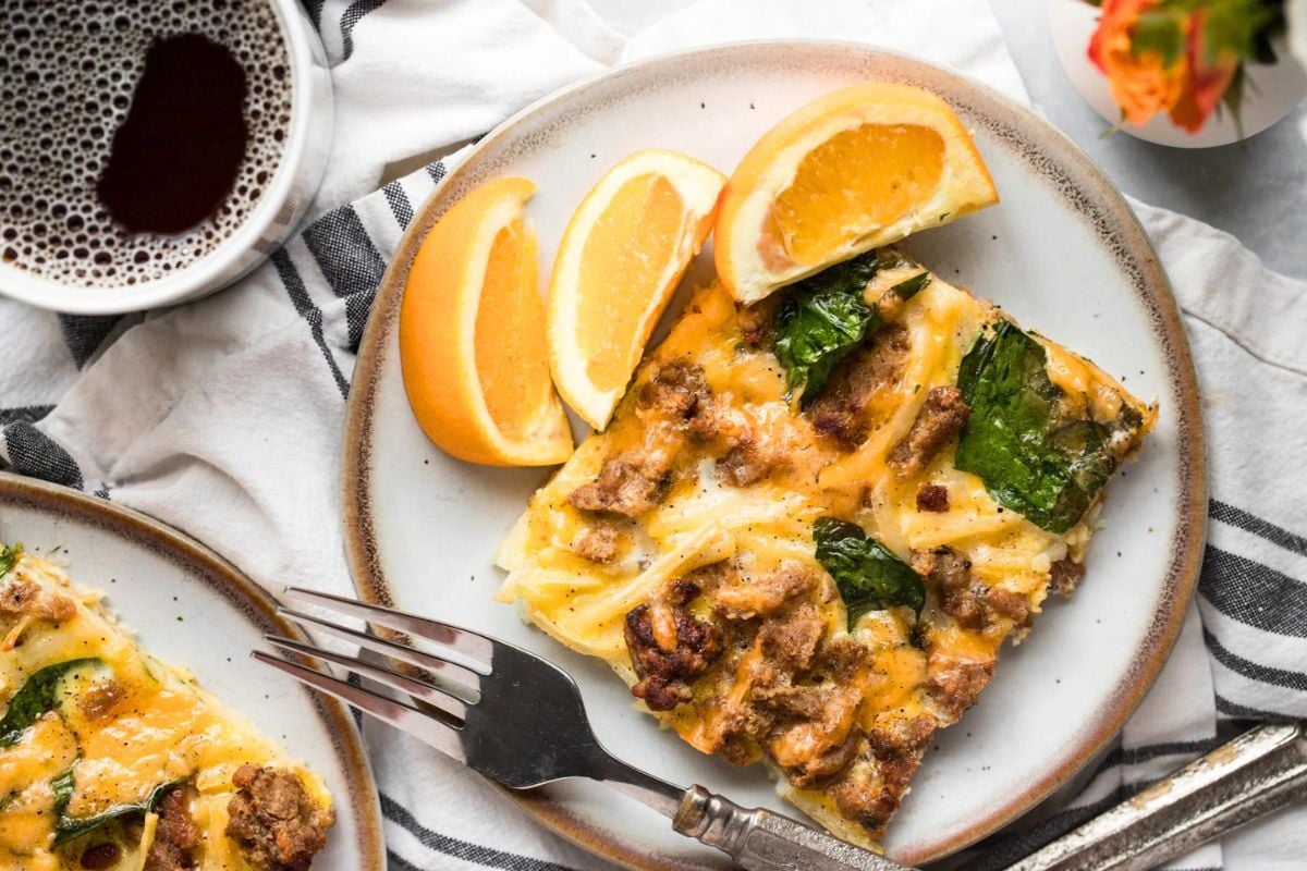 Sheet Pan Sausage Breakfast Pizza served on a plate.