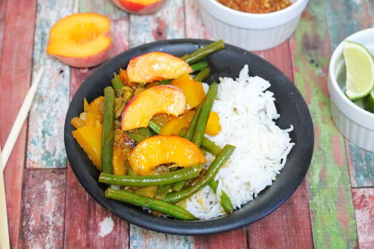 Sweet peach curry on a plate.