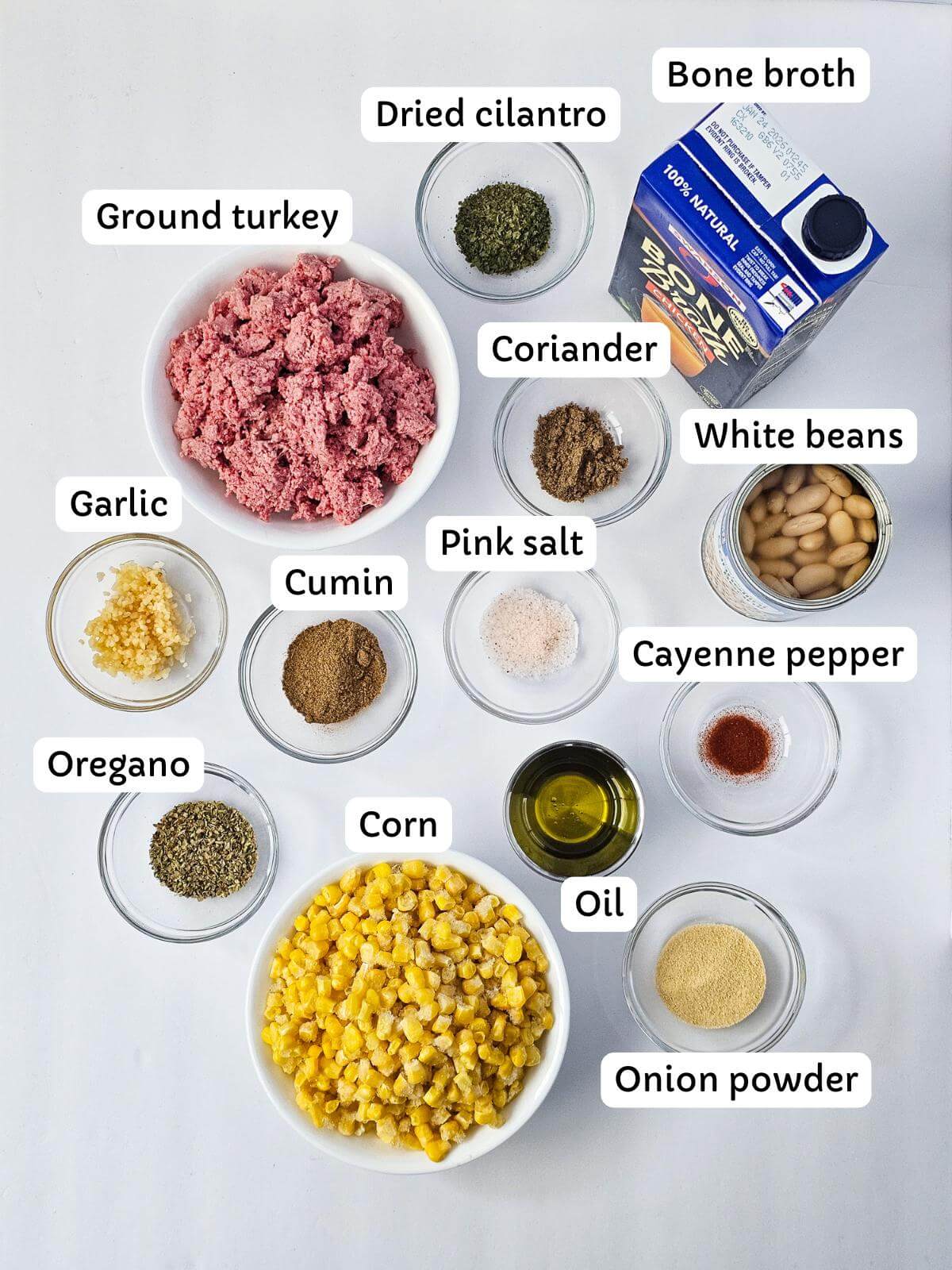 Ingredients for making turkey white bean chili in bowls.