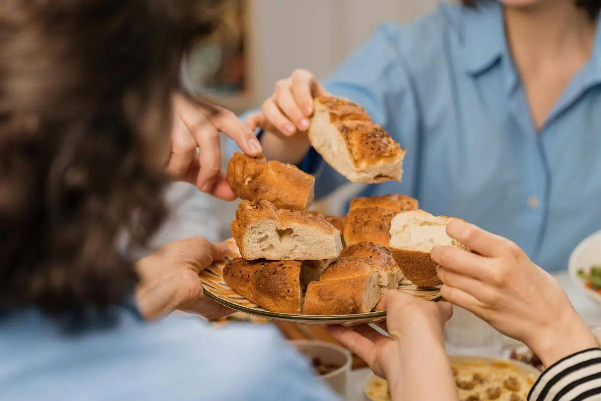 People sharing bread.