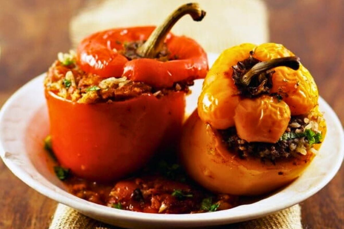 Lamb-Stuffed Peppers in Spiced Tomato Sauce served on a plate.
