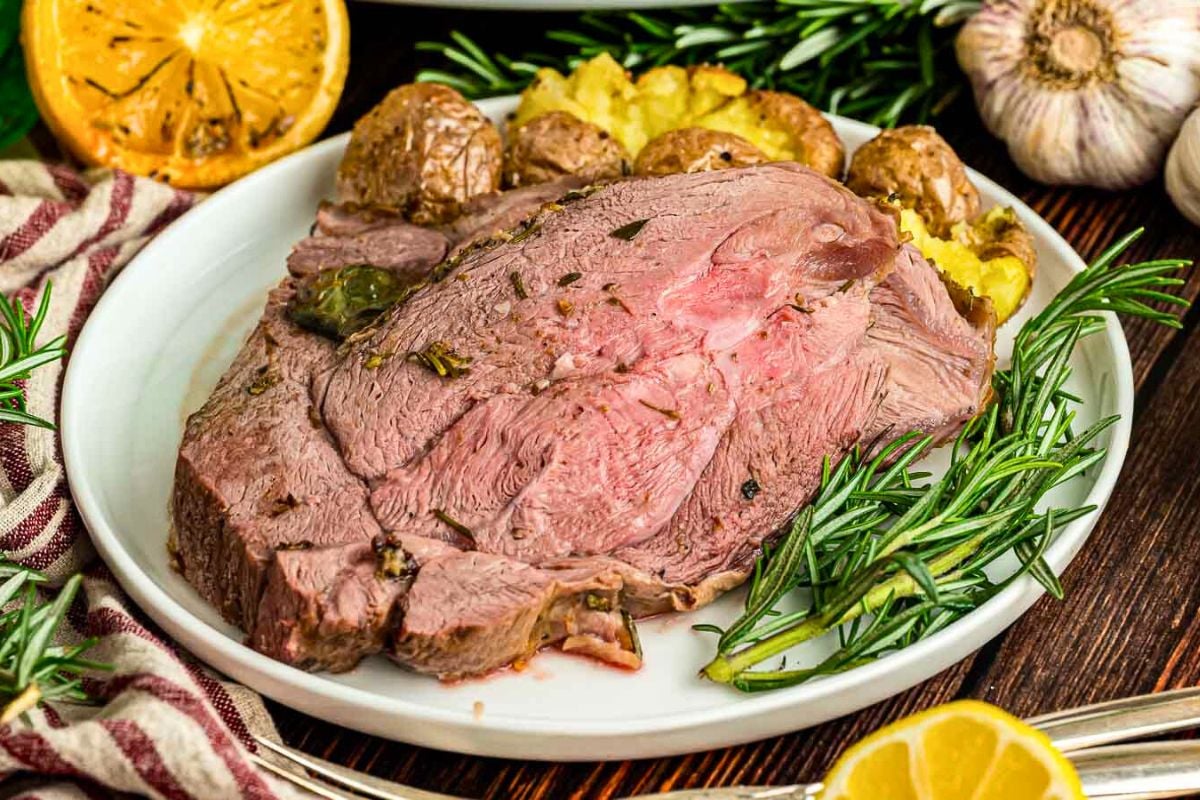 Roast Leg of Lamb served on a plate.