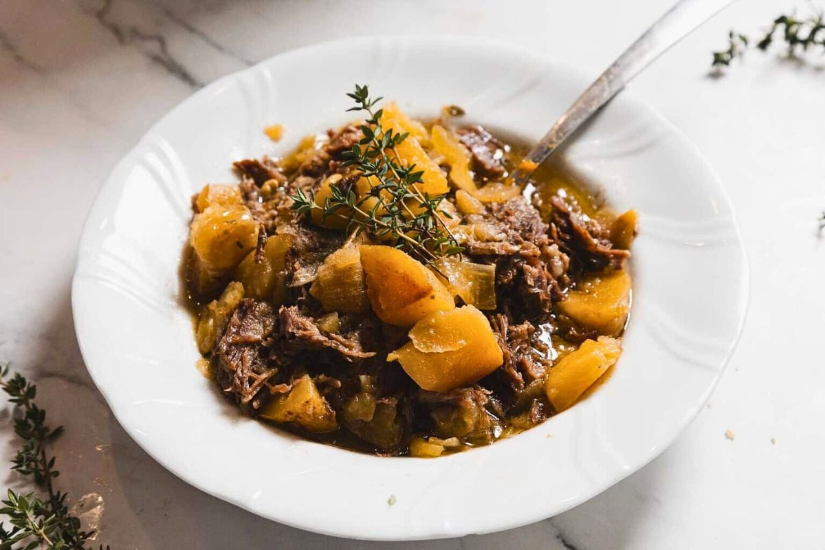 Maple-Dijon Instant Pot Pot Roast with Potatoes in a bowl.