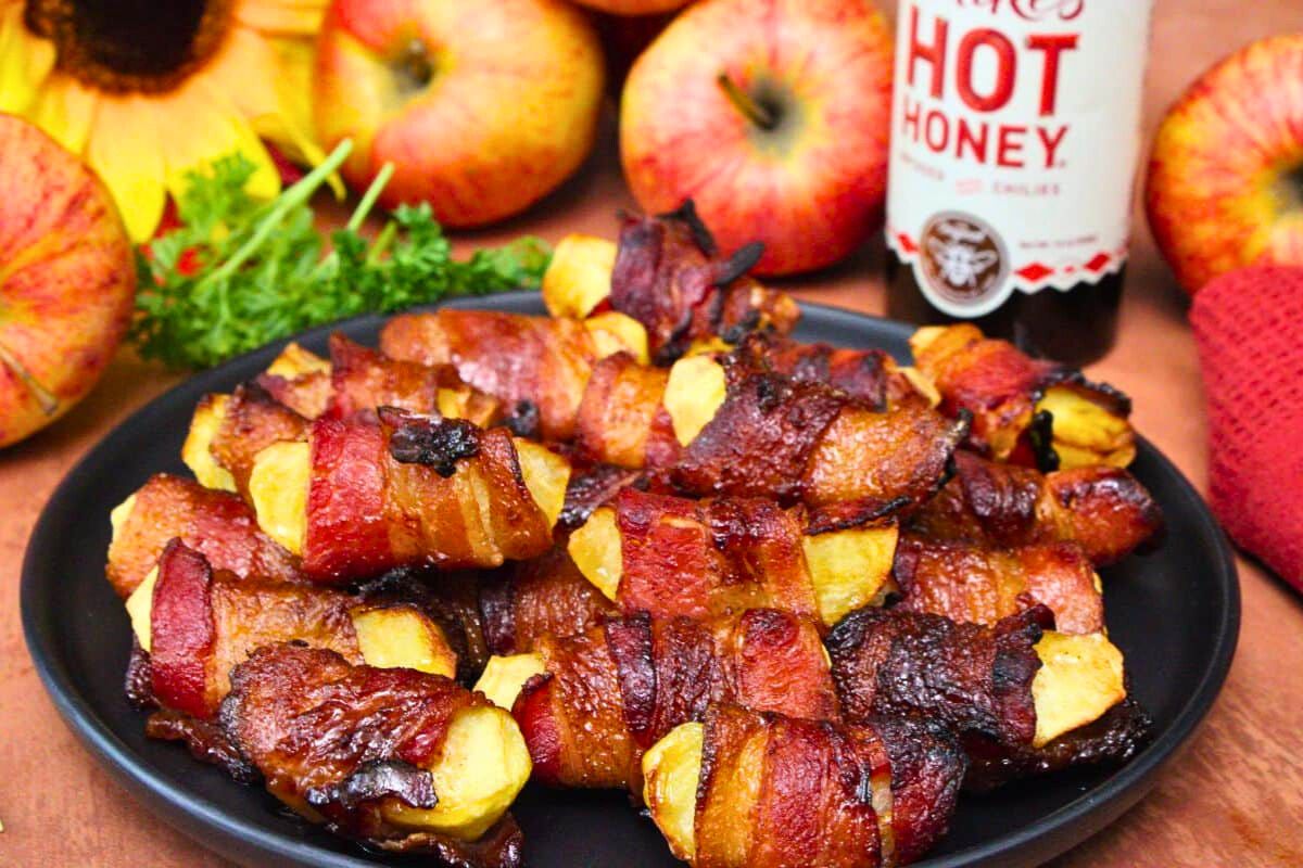Bacon Wrapped Apples served on a plate.