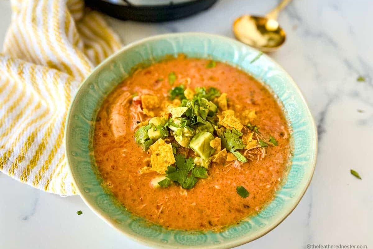 Instant Pot Creamy Chicken Tortilla Soup served in a bowl.