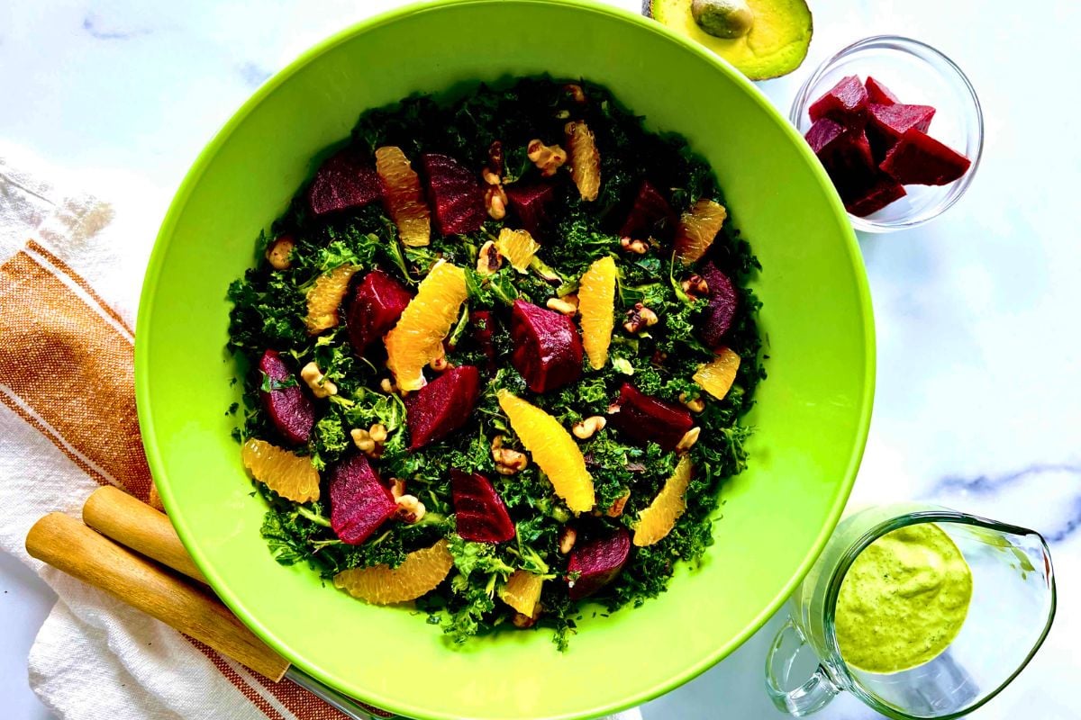 Kale Beet Salad with Avocado Green Goddess Dressing in a bowl.