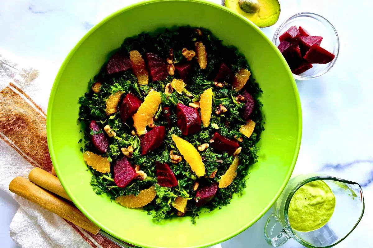 Kale Beet Salad with Avocado Green Goddess Dressing in a bowl.
