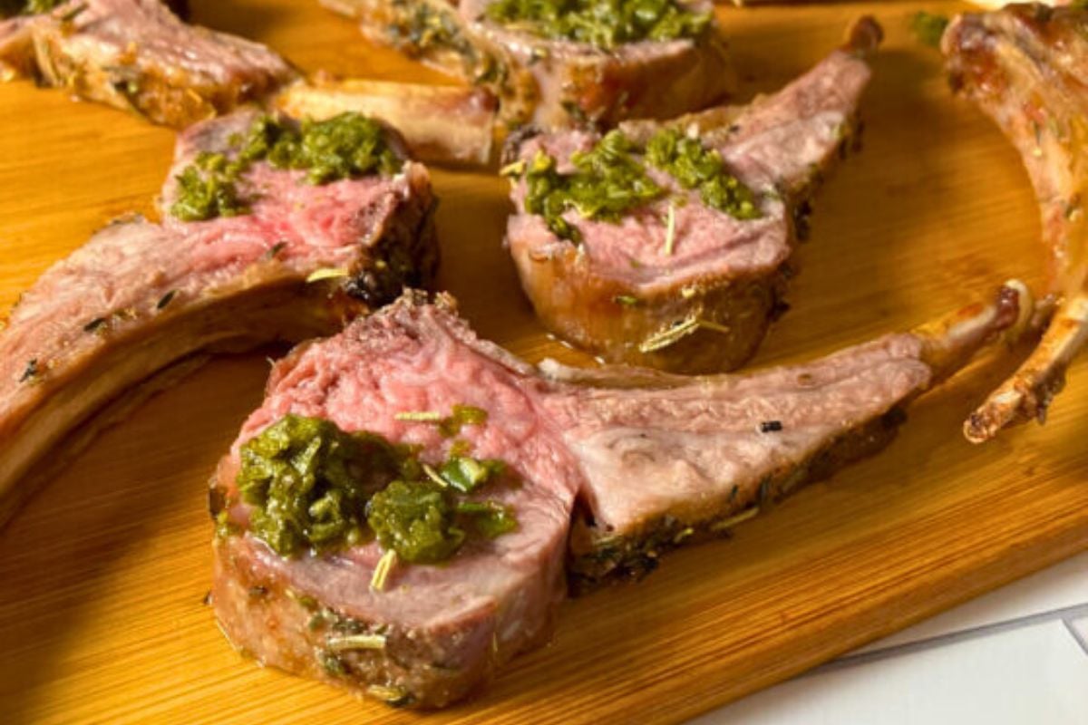 Air Fryer Rack of Lamb on a wooden board.