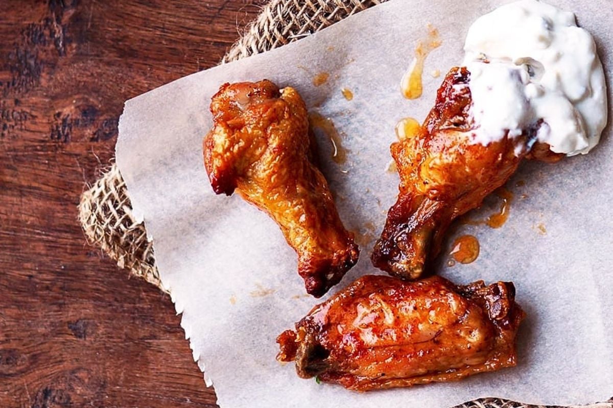 Baked Buffalo Wings with Homemade Blue Cheese Dressing close up look.