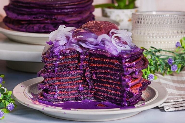 Ube Mochi Pancakes With Ube Glaze on a plate.