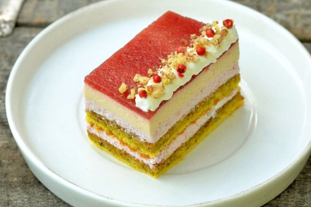 23 Foods People Used to Bring to Parties Like It Was Mandatory 22 Pistachio Strawberry Cake on a plate.