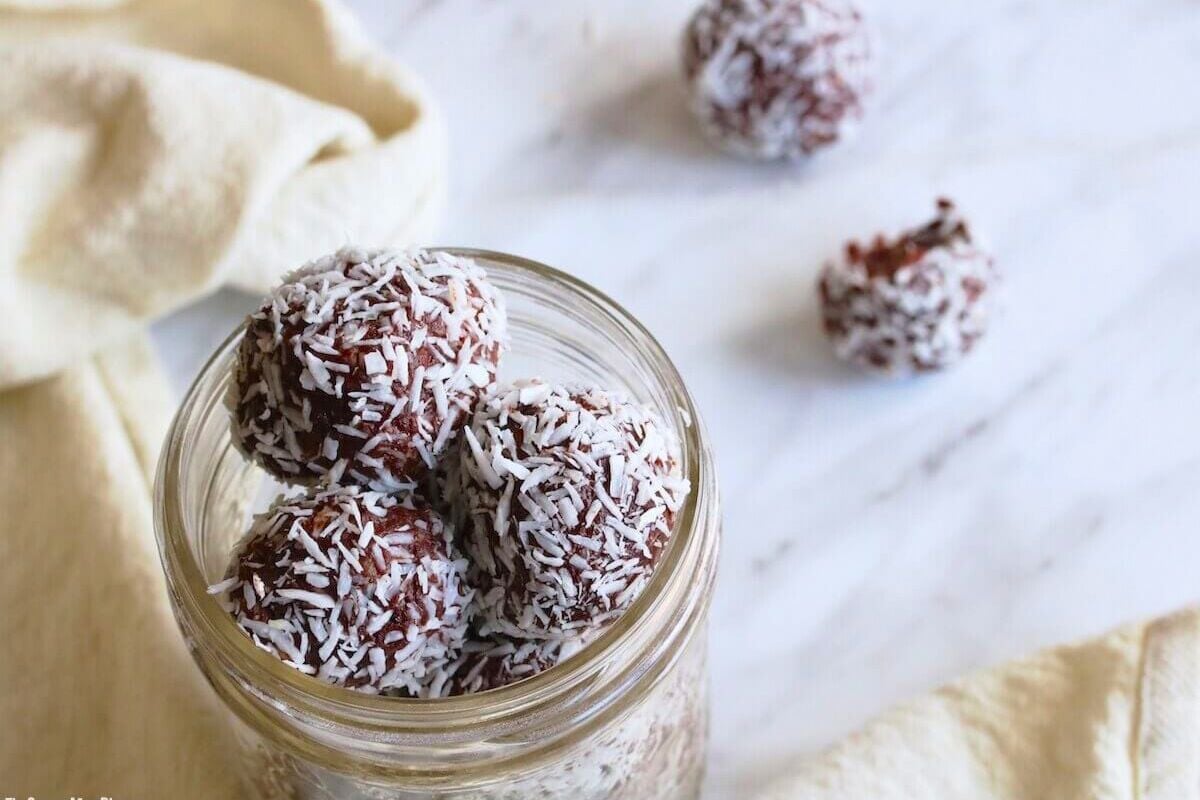 Chocolate Coconut Energy Balls in a jar.