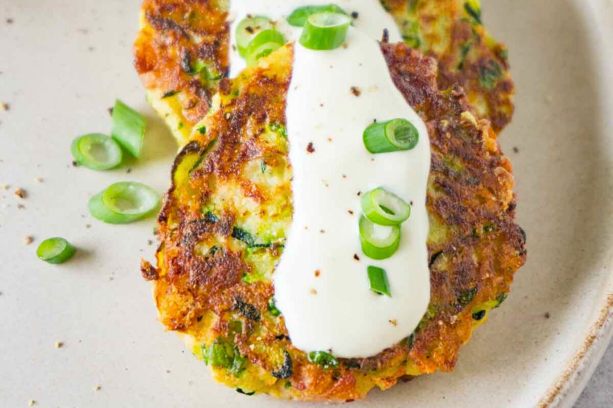Keto zucchini fritters with bacon close up look.