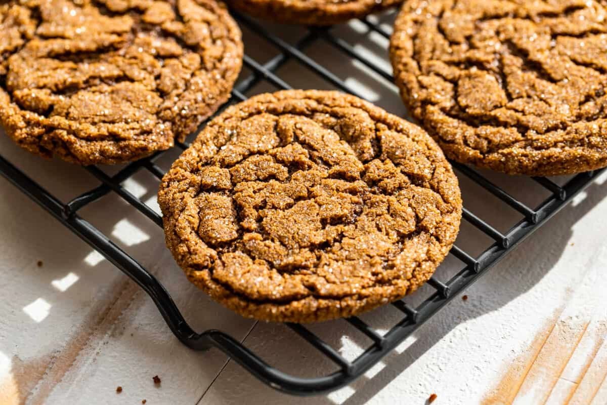 Molasses Ginger Cookies on a cooling rack.
