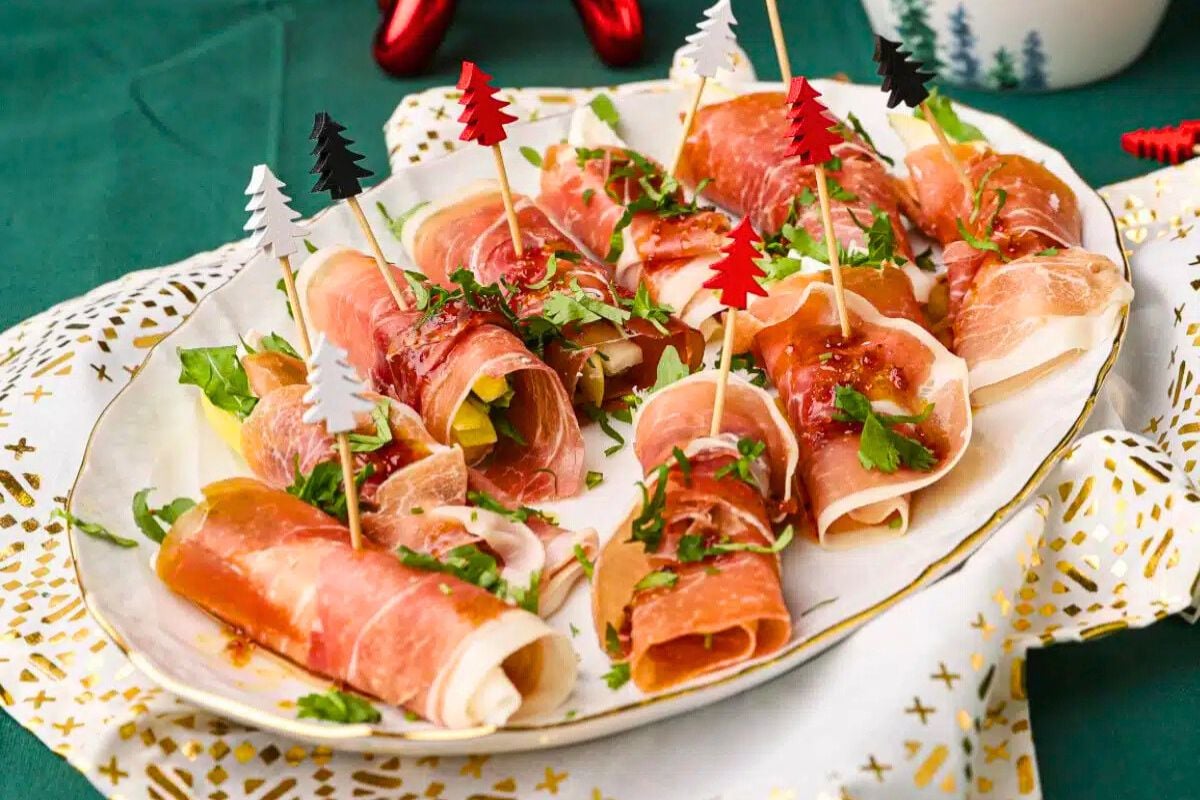 Prosciutto-Wrapped Pear & Cheese Rolls served on a plate.