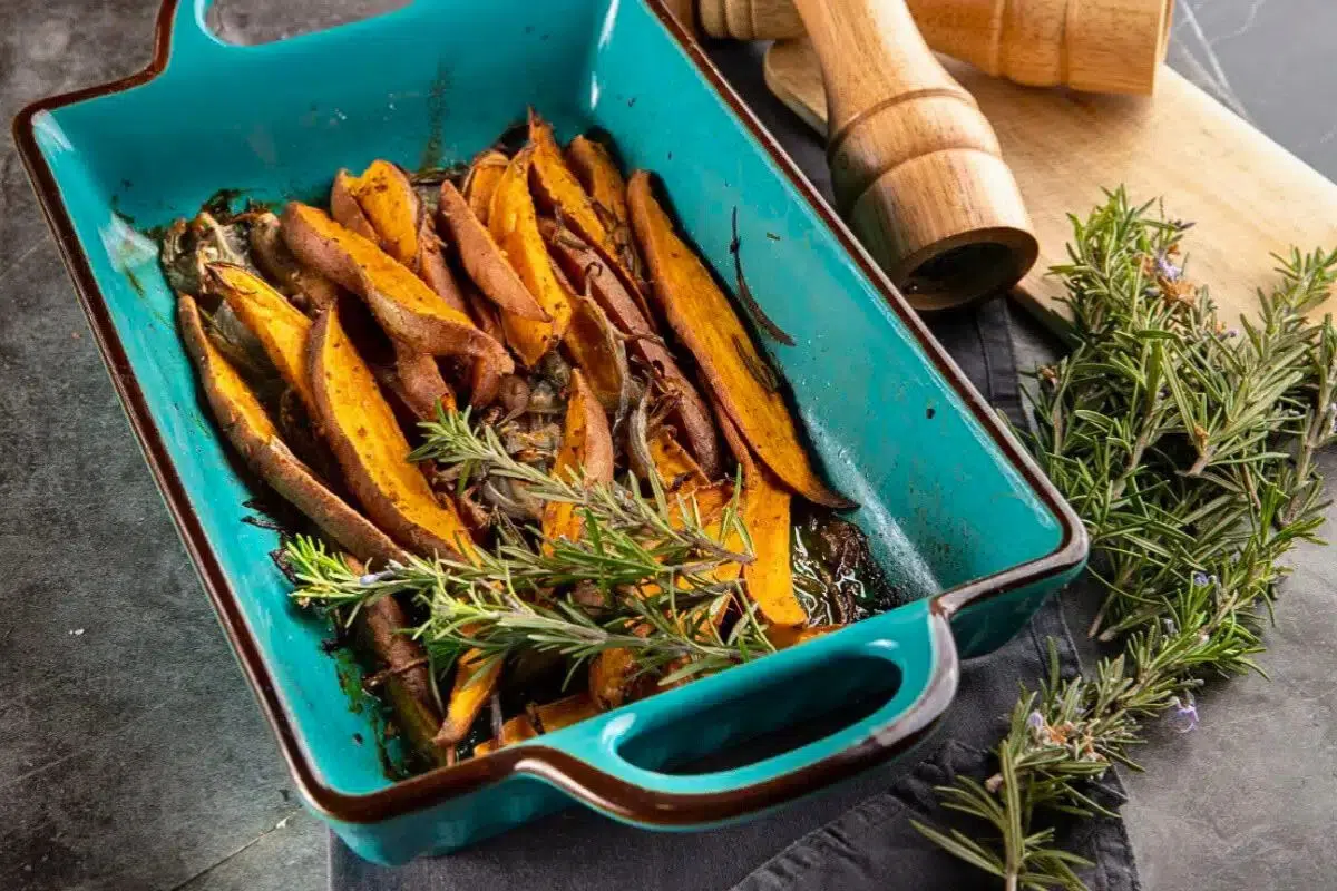 Roasted Sweet Potatoes with Rosemary in a baking dish.