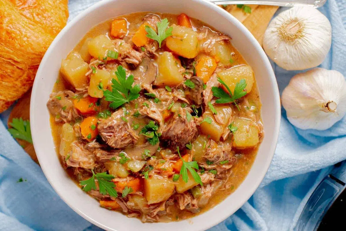 Slow Cooker Beef Stew With Mushrooms garnished with parsley.