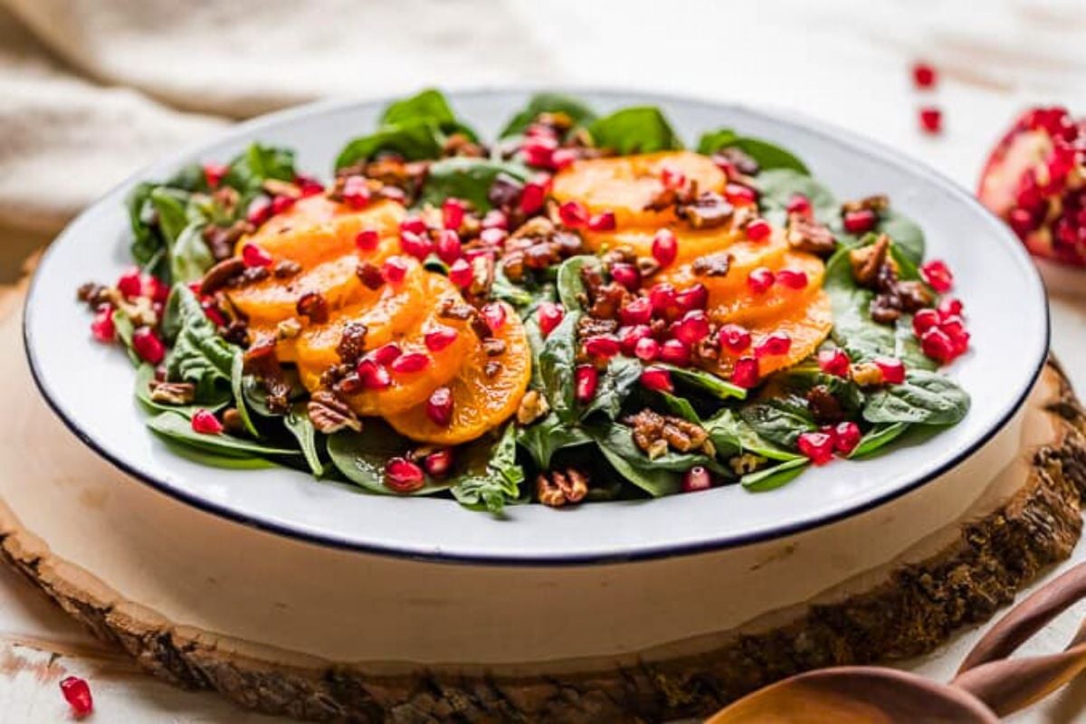 Spinach Salad with Mandarin Oranges on a plate.