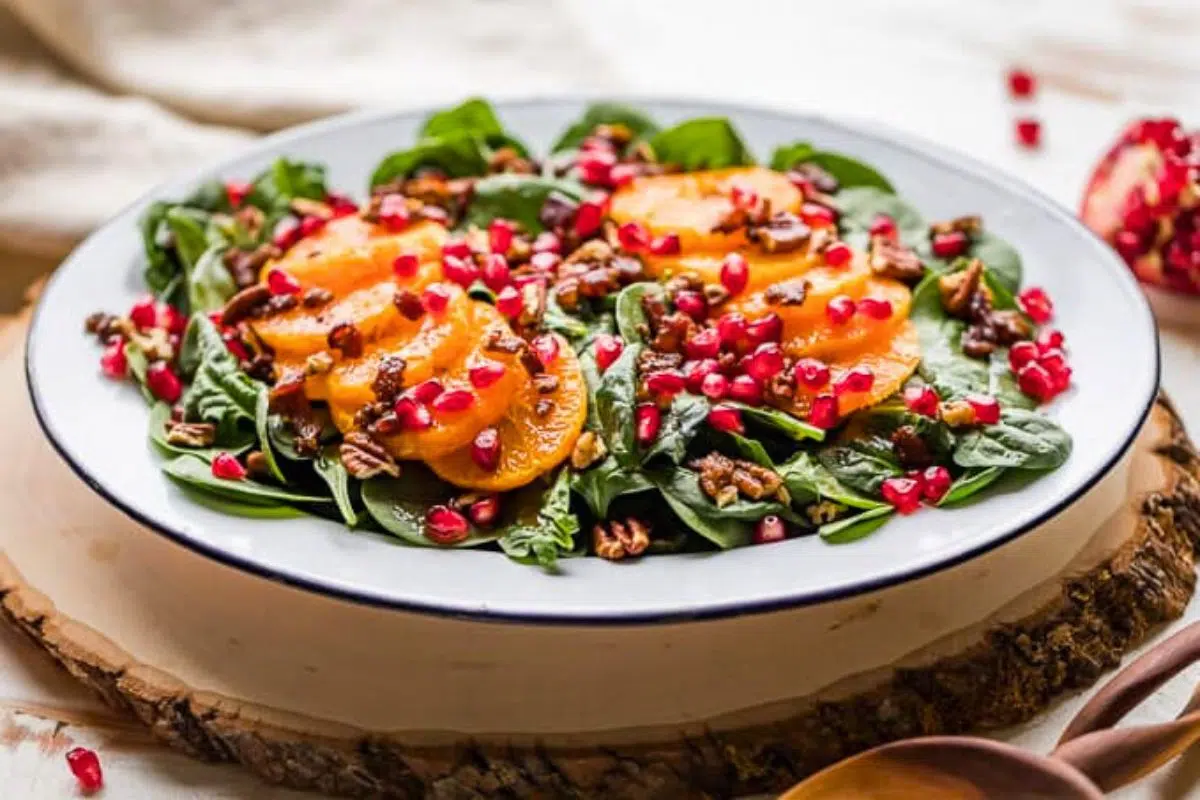 Spinach Salad with Mandarin Oranges on a plate.