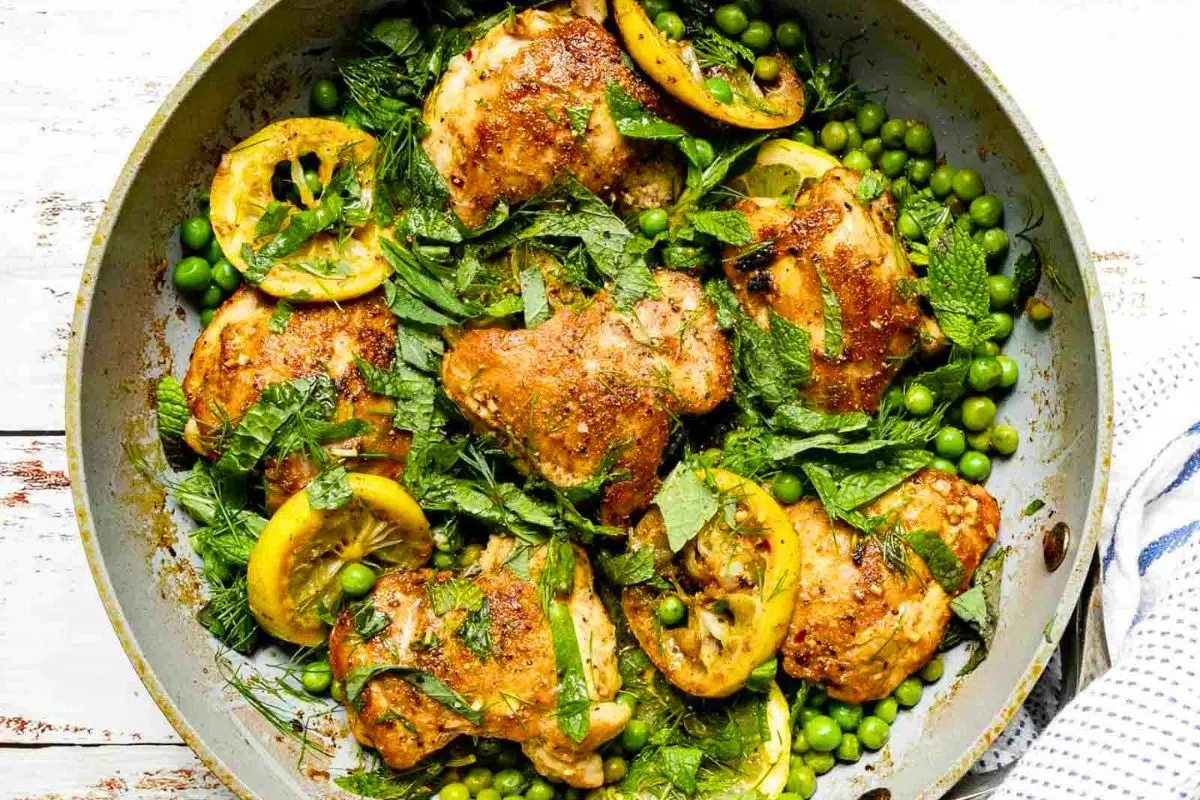 Skillet Chicken and Peas With Fresh Herbs overhead view.