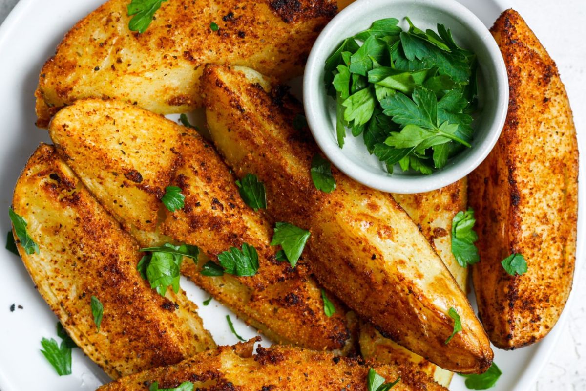 Air Fryer Potato Wedges alongside parsley.