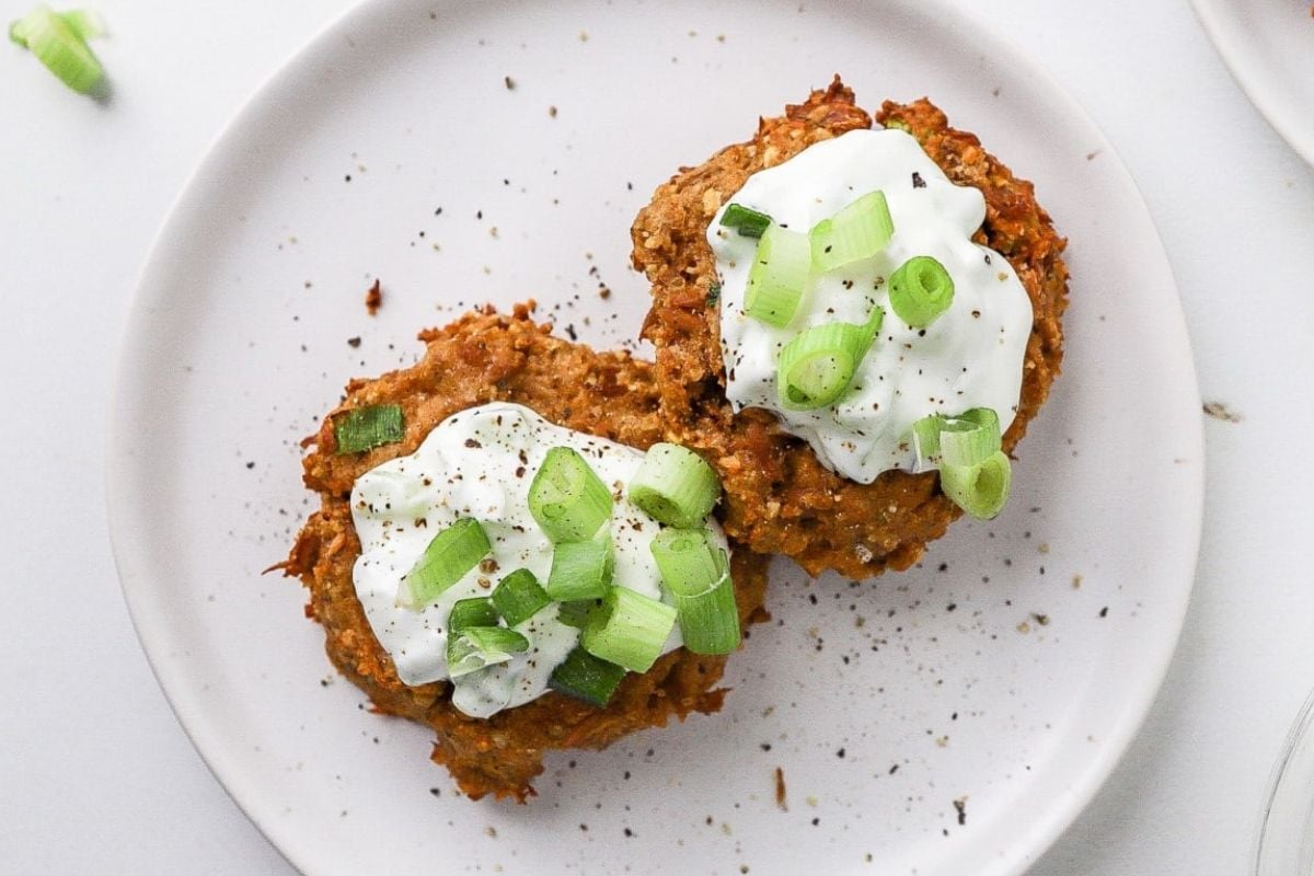 Air Fryer Tuna Cakes topped with mayo and chopped spring onions.