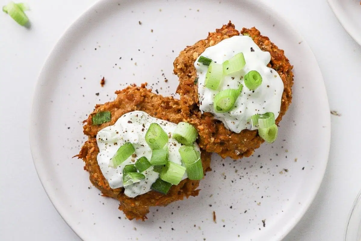 Air Fryer Tuna Cakes topped with mayo and chopped spring onions.
