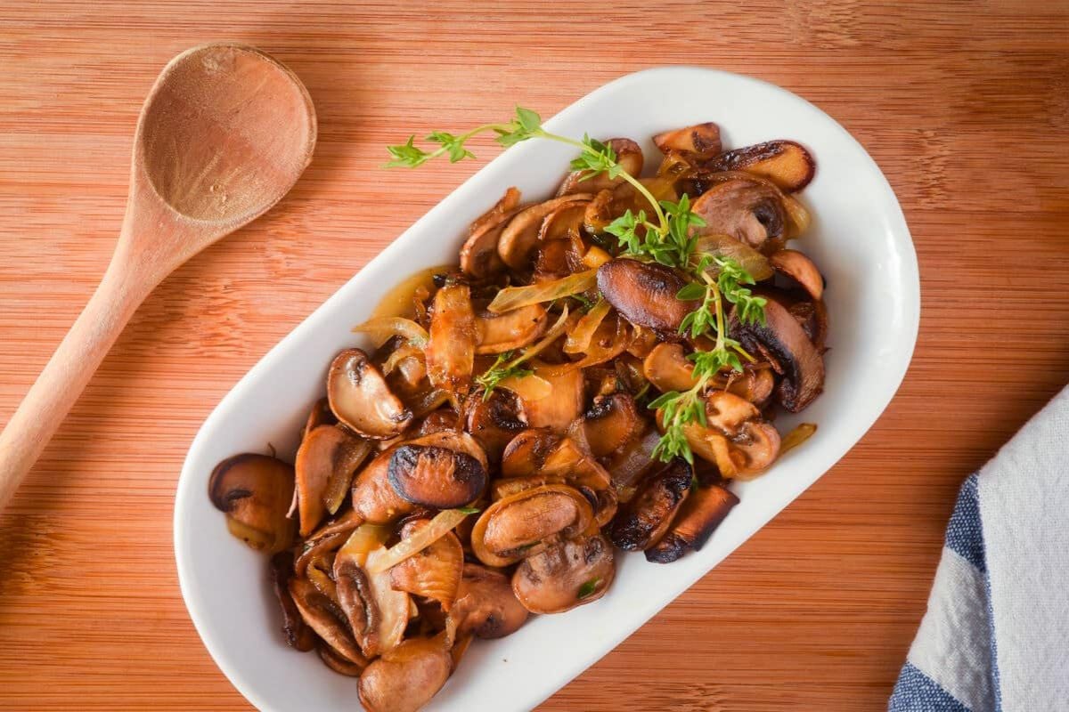 Butter Sautéed Mushrooms and Onions on a plate.