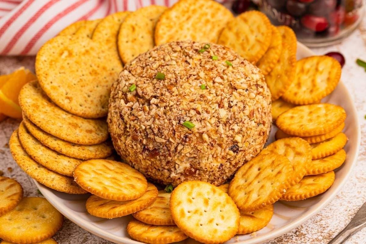 21 Foods That Used to Be Everywhere at Church and School Events 8 Cranberry Orange Cheese Ball with crackers.