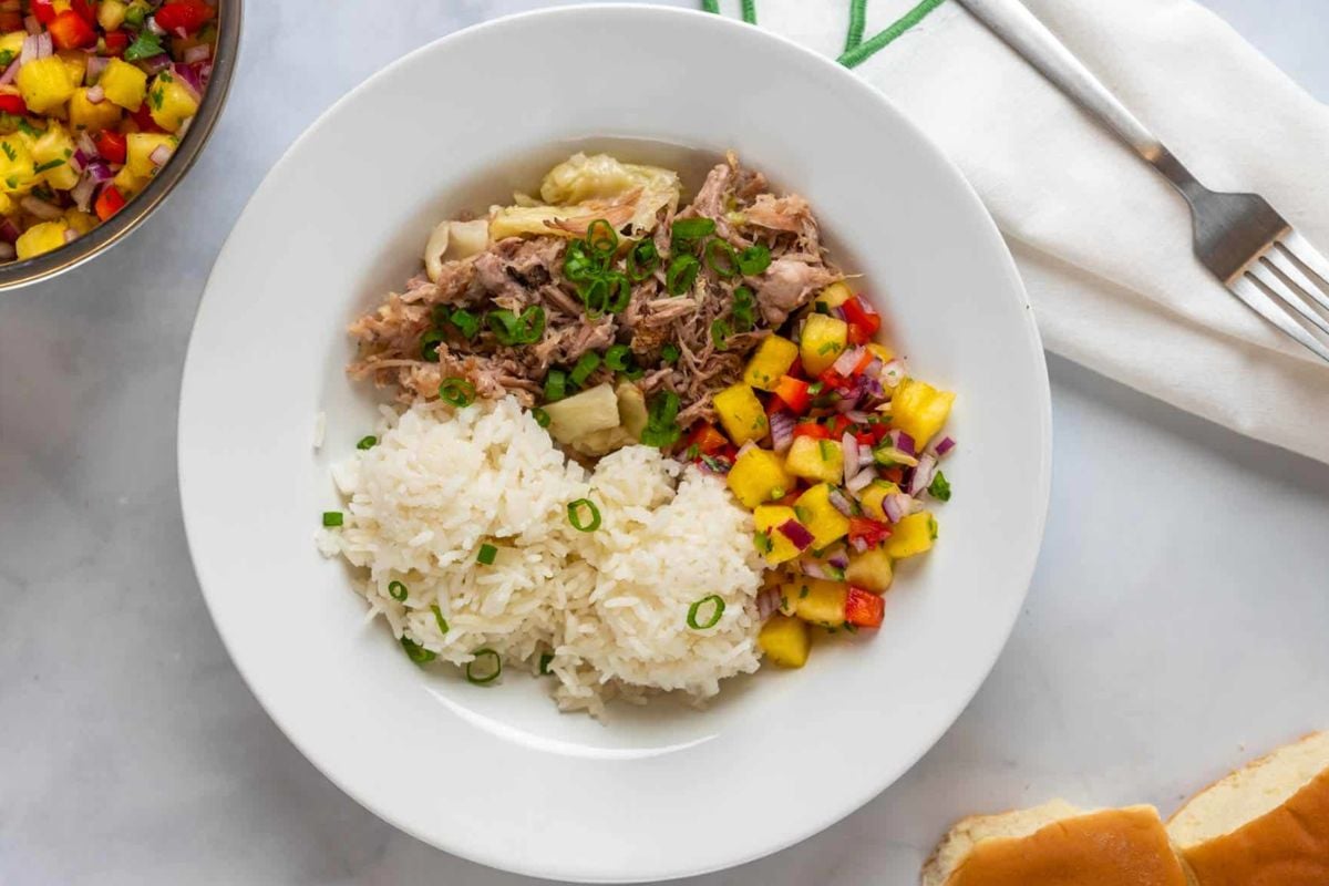 Slow Cooker Hawaiian Kalua Pork with Cabbage served with rice.