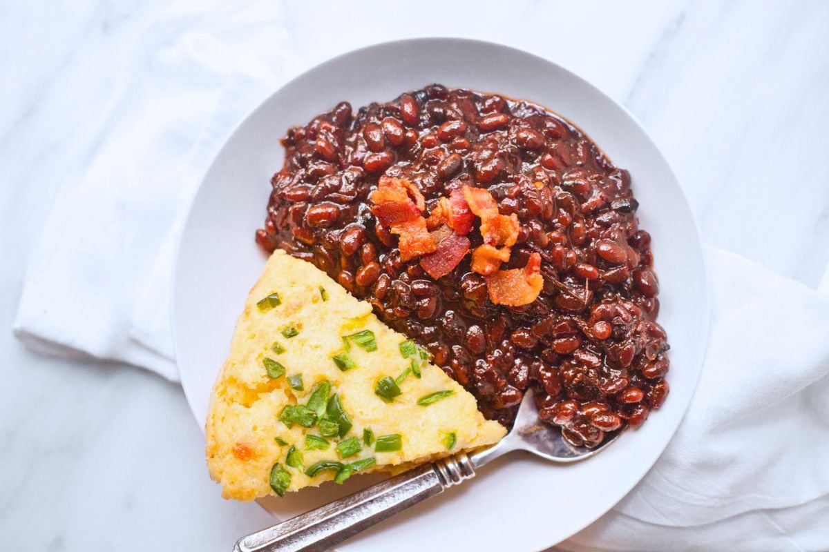 Slow Cooker Bacon Brown Sugar Baked Beans served on a plate.